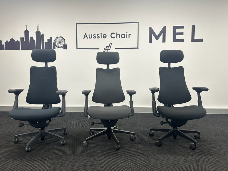 Three LiberNovo Omni-series chairs lined up on the Aussie Chair Melbourne showroom floor