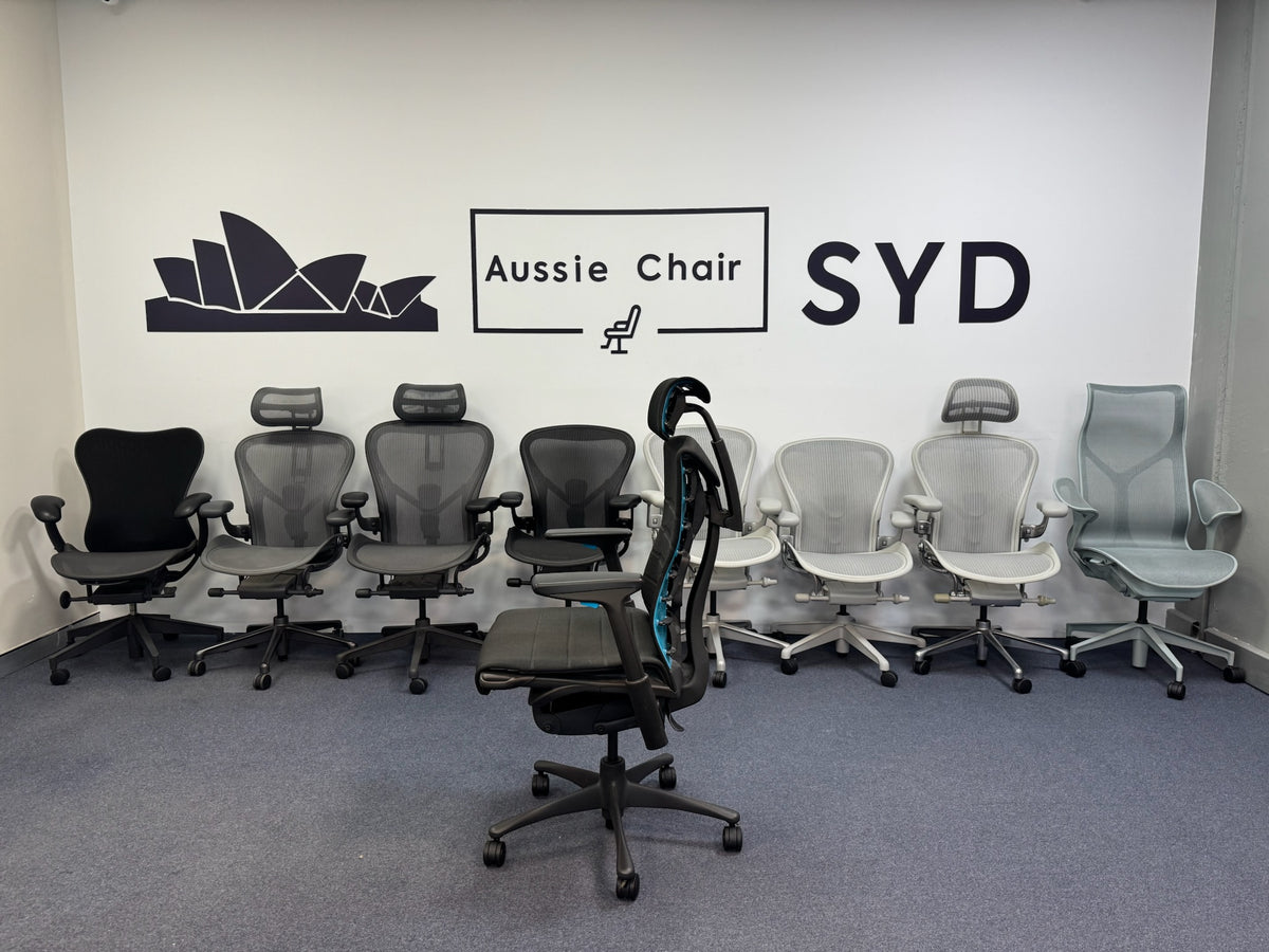 Herman Miller Embody Gaming Chair in Black – with Atlas headrest fitted, rear three-quarter view in Sydney showroom