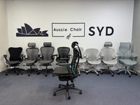 Herman Miller Embody Gaming Chair in Black – with Atlas headrest fitted, rear three-quarter view in Sydney showroom