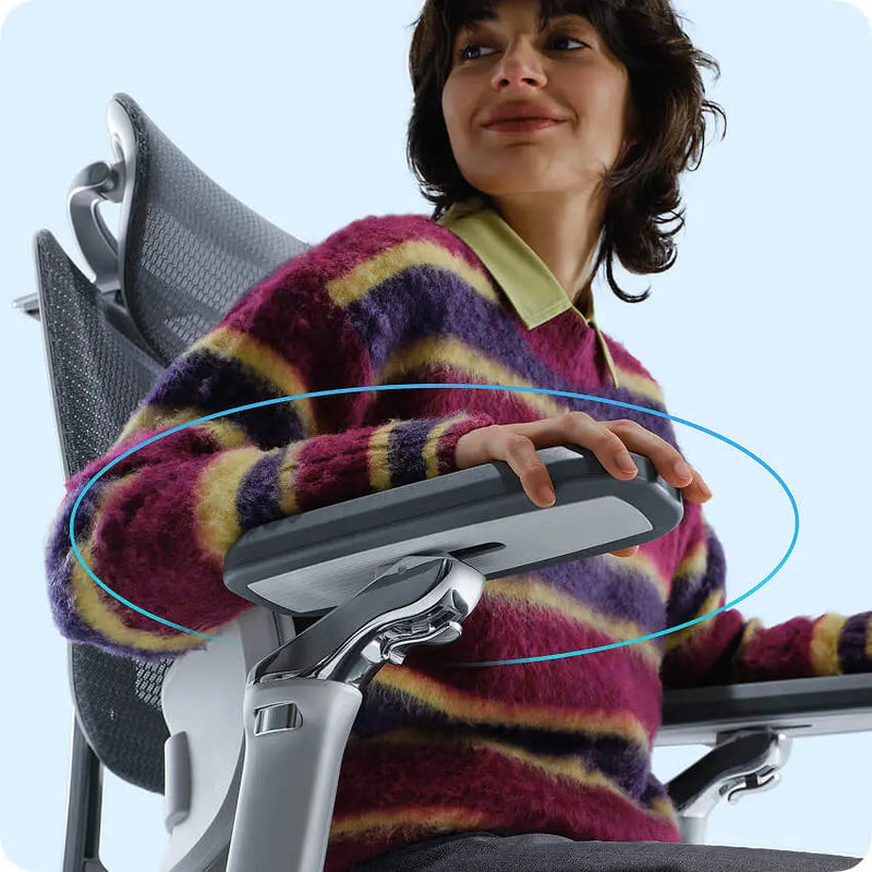 Woman resting her forearm on the HBADA E3 Pro 720-degree armrest