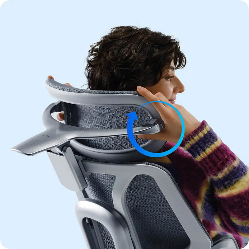 Woman adjusting the HBADA E3 Pro dual-axis headrest behind her neck
