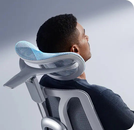 Man resting his head on the HBADA E3 Pro 4D dual-axis headrest
