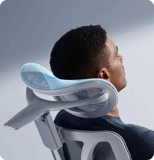 Man resting his neck on the HBADA E3 Ultra 4D dual-axis headrest