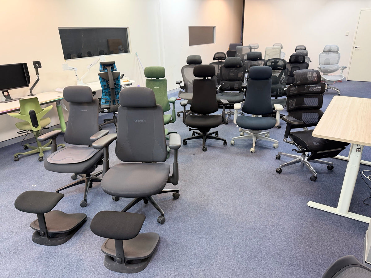 Ergonomic chairs including HBADA and LiberNovo on the floor of an Aussie Chair showroom