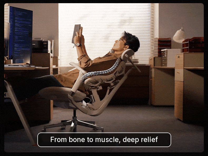 Man reclining far back in the HBADA T8 Max while reading, fully supported from head to seat