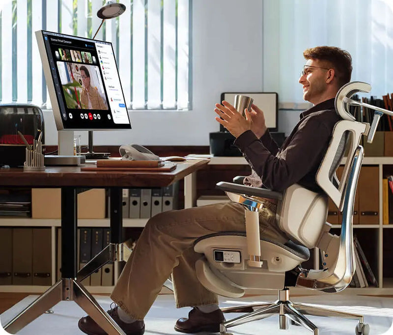 Business executive on a video call while sitting in the HBADA X7 in a home office