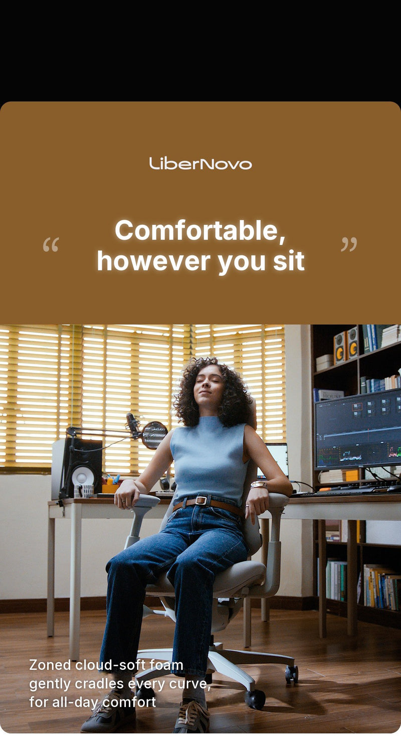 LiberNovo Omni Gen in a home studio, woman reclining with eyes closed on the zoned cloud-soft foam seat