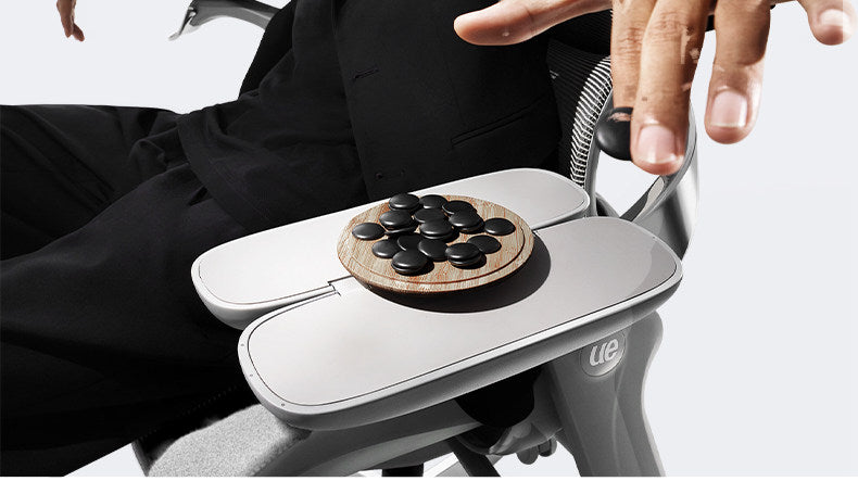 UE FLOW 660 Pro Magic\u2122 armrest folded out as a small table holding a game board